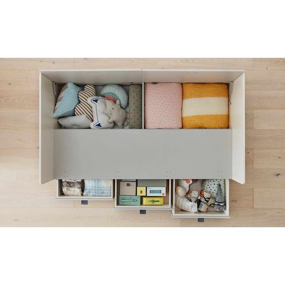 Iloom Tiede Bed storage in white with three open drawers filled with toys and linens.