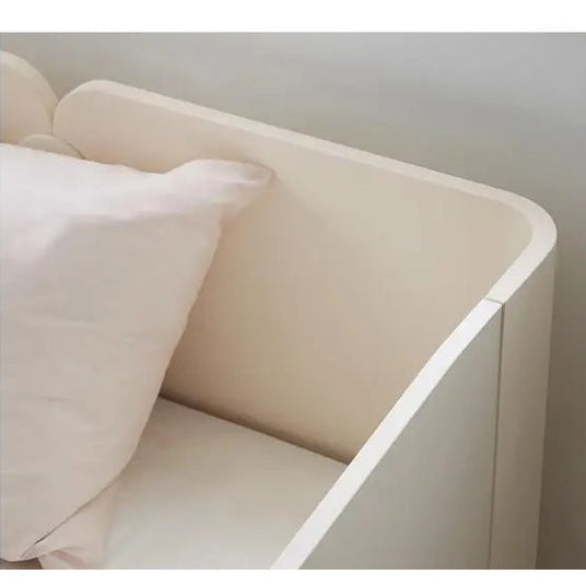 Iloom Tinkle Pop 1 Story Bed in white with a beige pillow, raised side rail visible for safety.