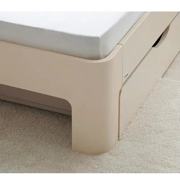 Iloom Tinkle Pop 1 Story Toddler Bed in beige with a low-profile rounded frame and white mattress sits on carpet.