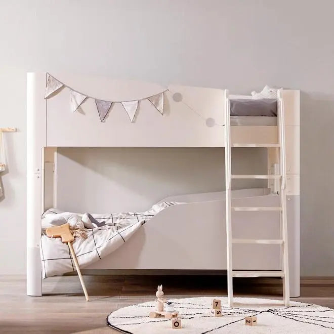Iloom Tinkle Pop 2 Story Bed (Ladder Type) in white, ladder to top bunk and cozy bottom bunk with bunting.