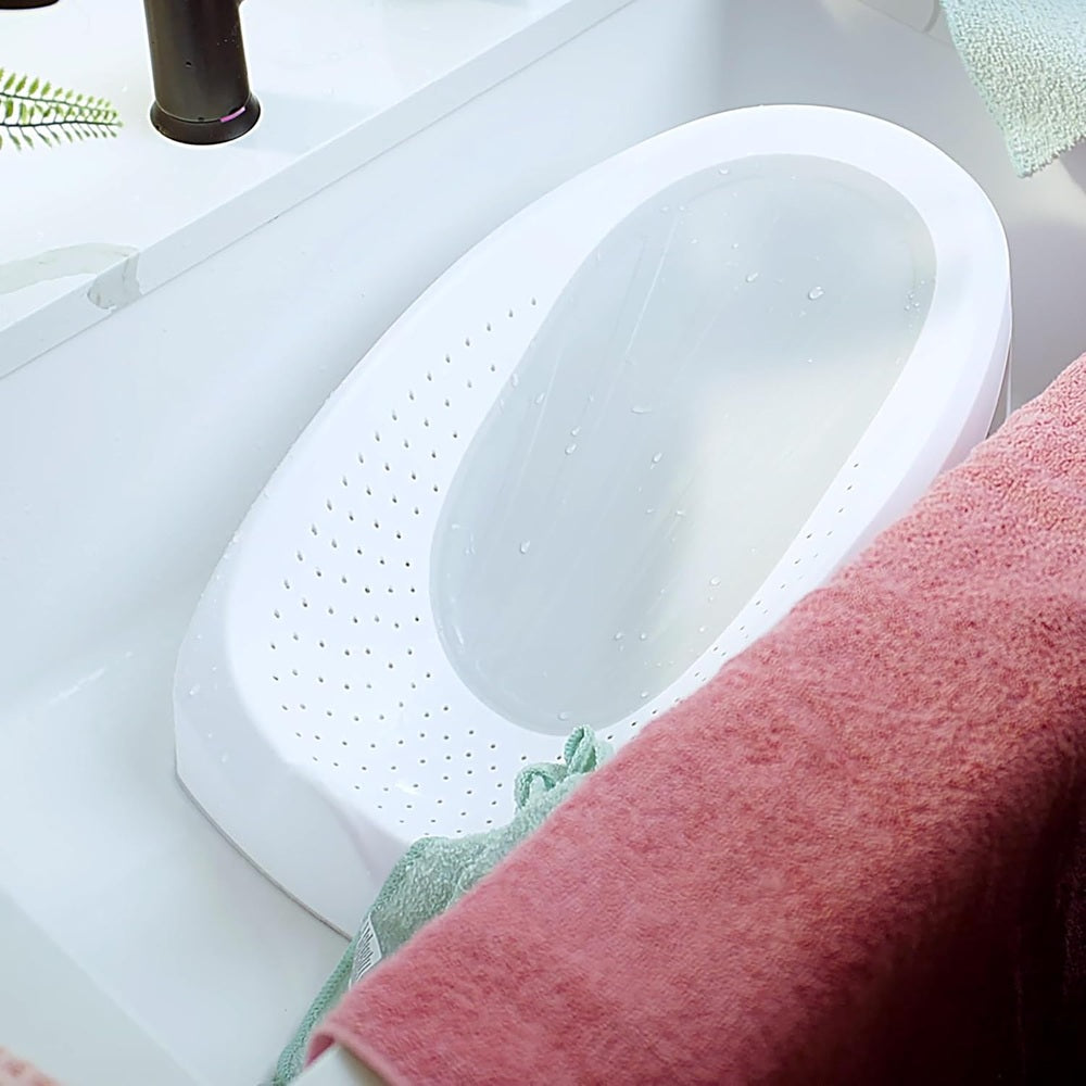 Ity by Ingenuity Easy Rinse Bather, white plastic baby bath seat with drainage holes