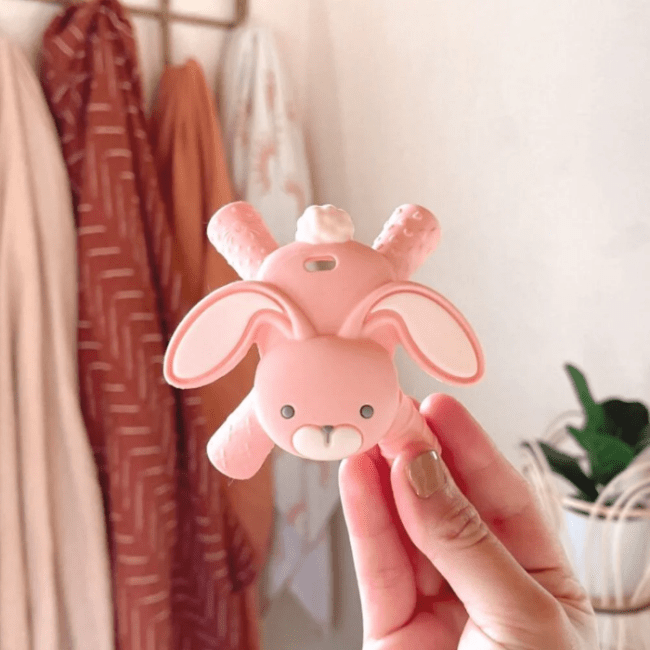 Itzy Ritzy baby molar teether, pink silicone bunny with large floppy ears