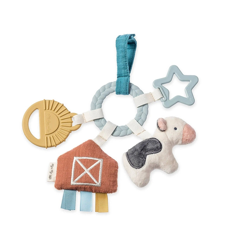 Itzy Ritzy Bitzy Busy Ring Teething Activity Toy with braided ring, star, plush animal, and ribbons for teething.