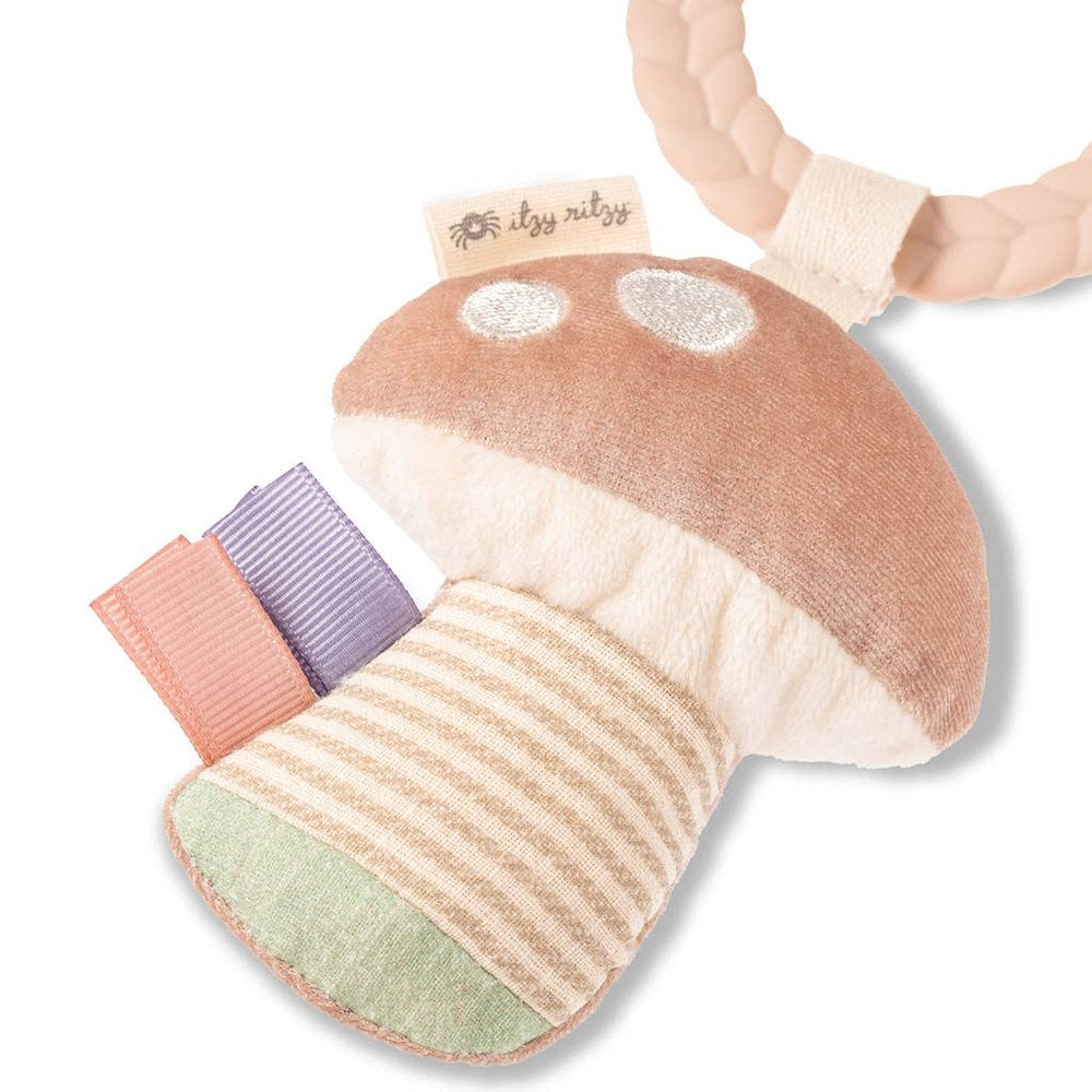 Bitzy Busy Ring teething toy by ITZY RITZY; plush pastel pink mushroom with striped stalk and pastel ribbons