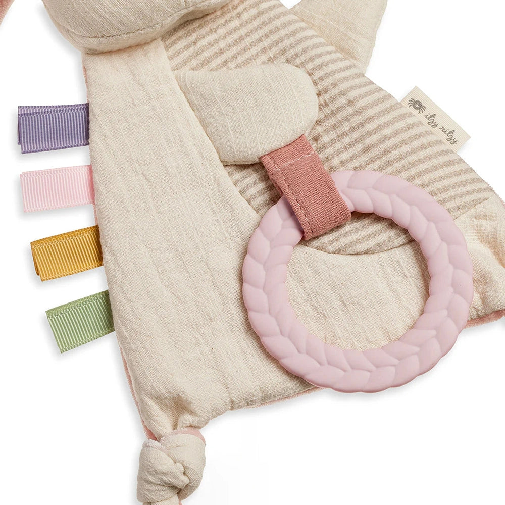 Itzy Ritzy Bitzy Crinkle Sensory Toy with Teether featuring a pink braided ring and pastel ribbon tabs