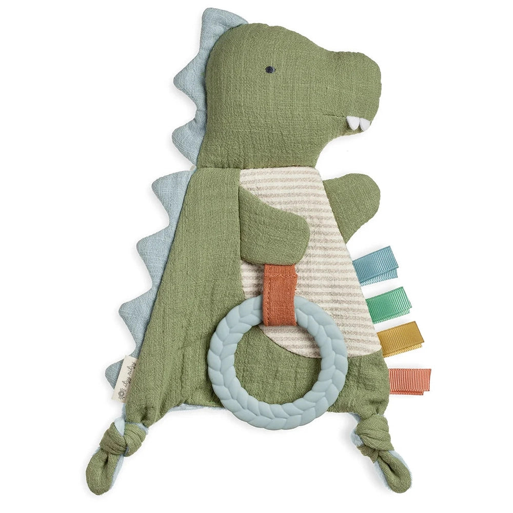 Itzy Ritzy Bitzy Crinkle Sensory Toy with Teether; green dinosaur plush with a light blue braided ring and colorful tabs.