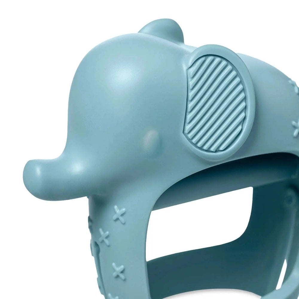 Itzy Ritzy Bitzy Grip blue silicone teething toy with a ribbed wheel grip being squeezed by a child’s hand.