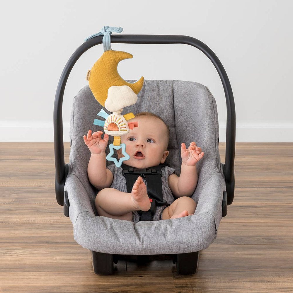 Itzy Ritzy Bitzy Notes Moon and Sun musical pull-down toy for baby, soft fabric hanging from car-seat handle