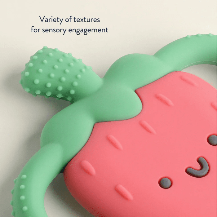 Itzy Ritzy Chew Crew teething toy, pink strawberry with green leafy accents