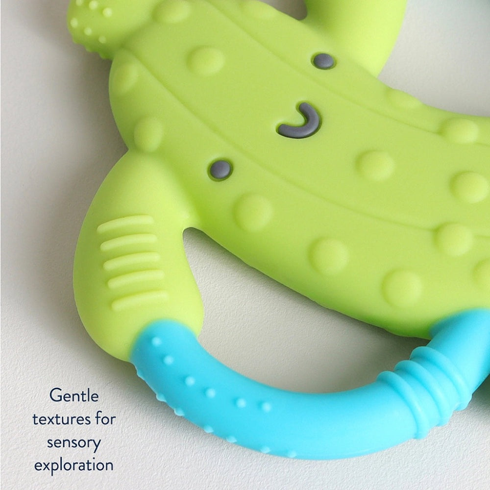 Itzy Ritzy Chew Crew teething toy in lime green with a blue textured handle