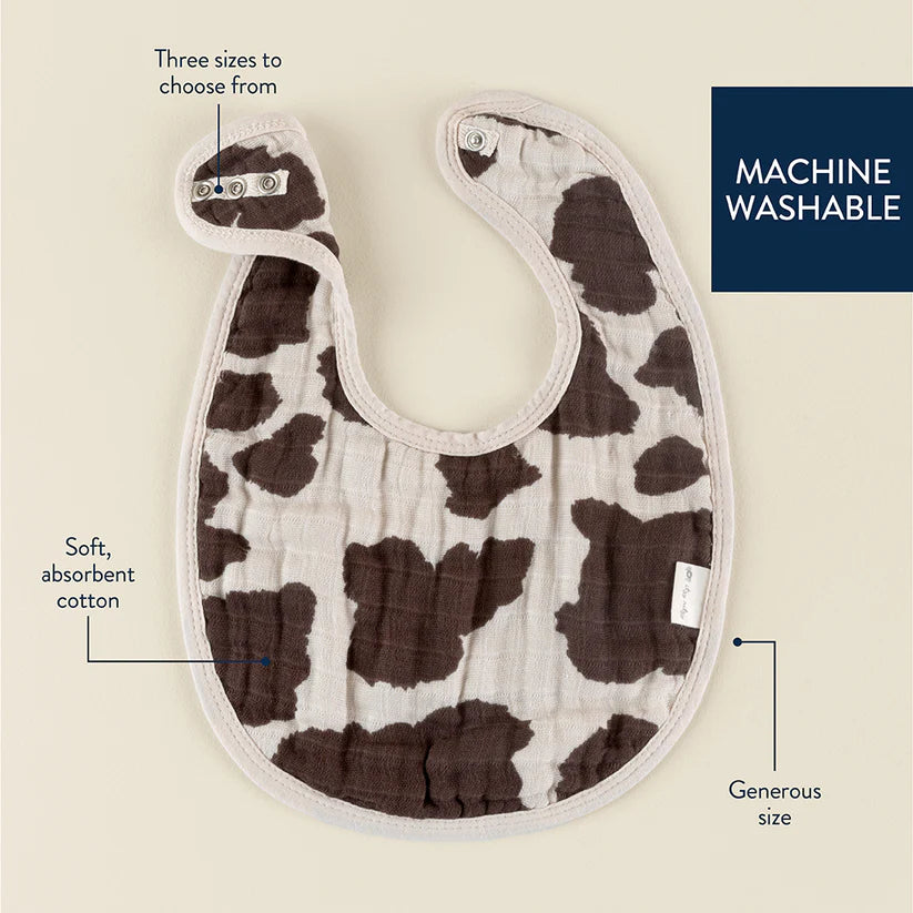 Itzy Ritzy Itzy Bibs cow-print bib, soft cotton, adjustable snaps, generous size, machine washable