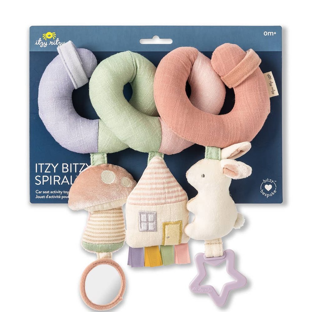 Itzy Ritzy Itzy Bitzy Spiral car seat activity toy with pastel plush spirals, bunny and mushroom house