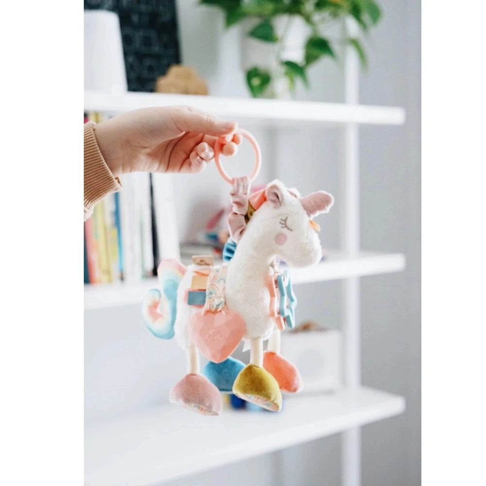 Itzy Ritzy Itzy Friends Link & Love unicorn activity plush, pastel pink and blue, soft plush texture