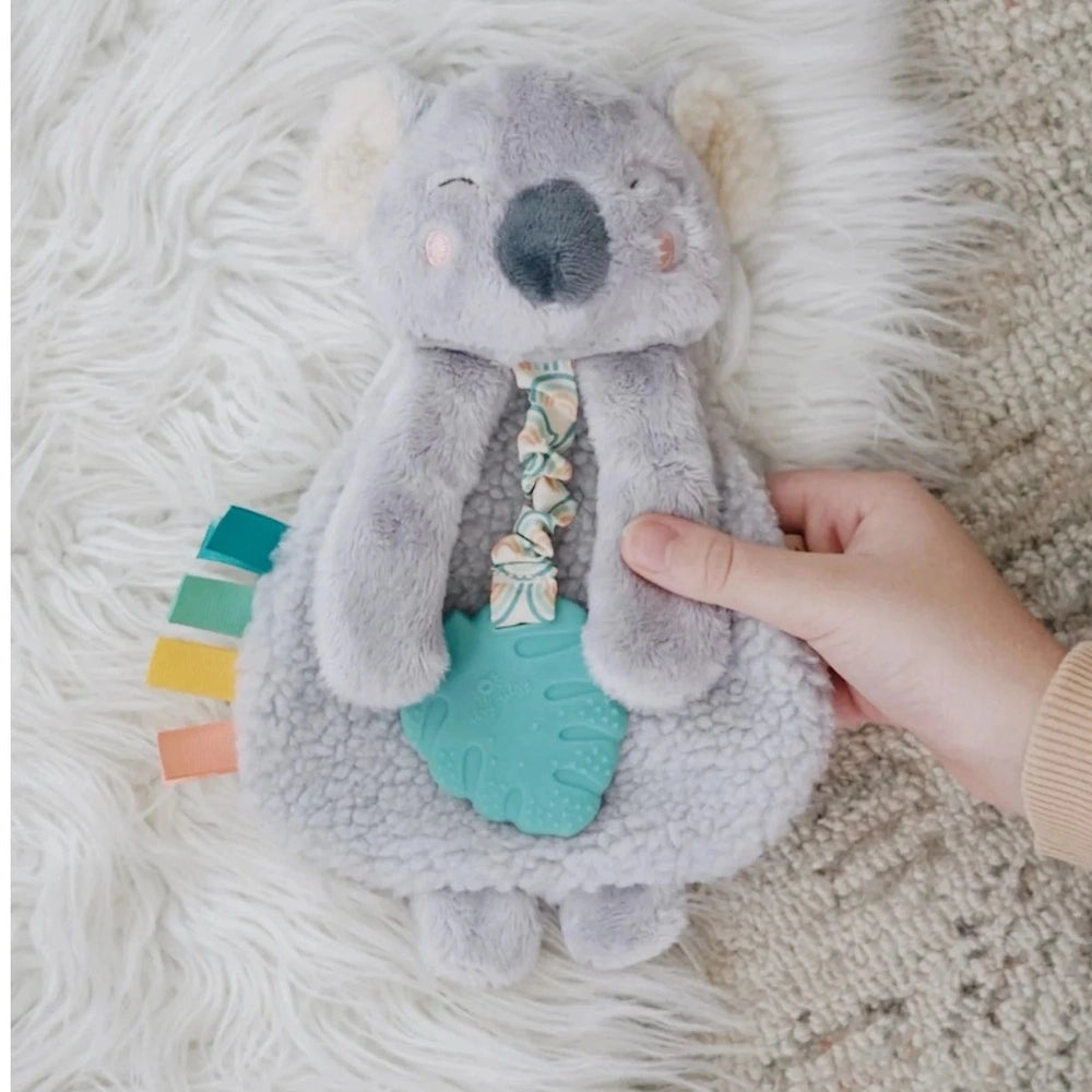 Itzy Ritzy Itzy Lovey plush and teether toy gray koala with teal silicone leaf teether and multicolor ribbon bow