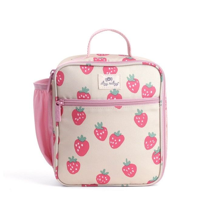 Itzy Ritzy Itzy Lunch Box Bag in beige strawberry print with pink zipper, handle, and side mesh pocket