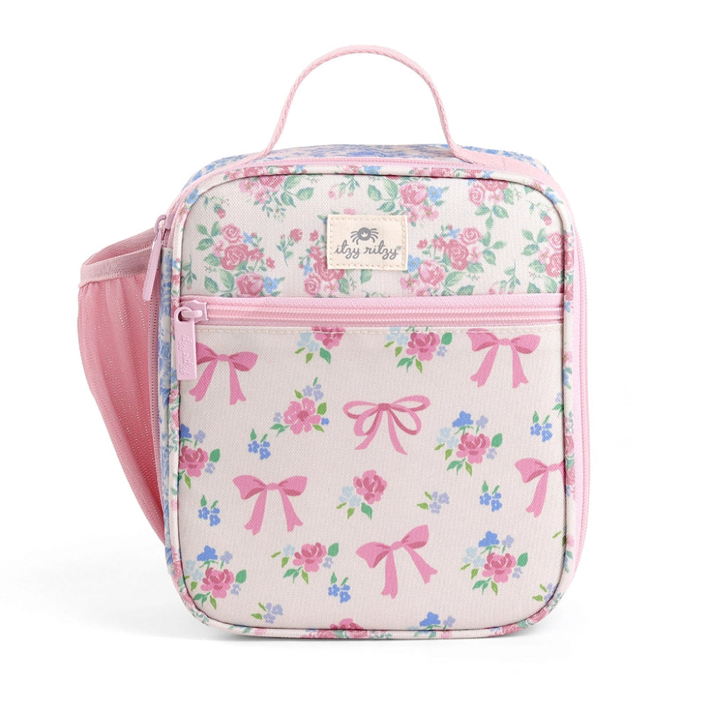 Itzy Ritzy Itzy Lunch Box Bag in pink floral print with top handle, pink zipper, and side mesh pocket.