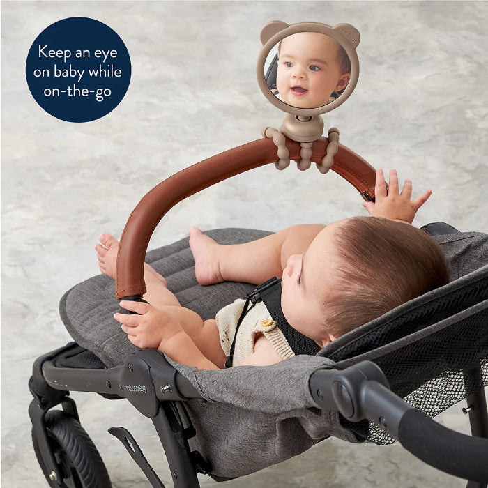 Itzy Ritzy Itzy Peek Stroller Mirror with bear-ear brown frame on a gray stroller, baby looking back