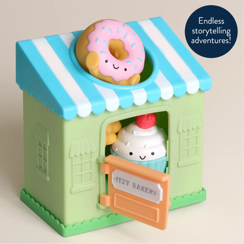 Itzy Ritzy Itzy Play Bakery Spill and Fill Toy, pastel green bakery with blue striped roof, smiling donut and cupcake figures
