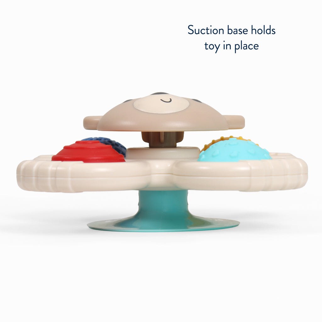 Side profile of the Itzy Pop & Whirl Circus toy showing its suction-cup base