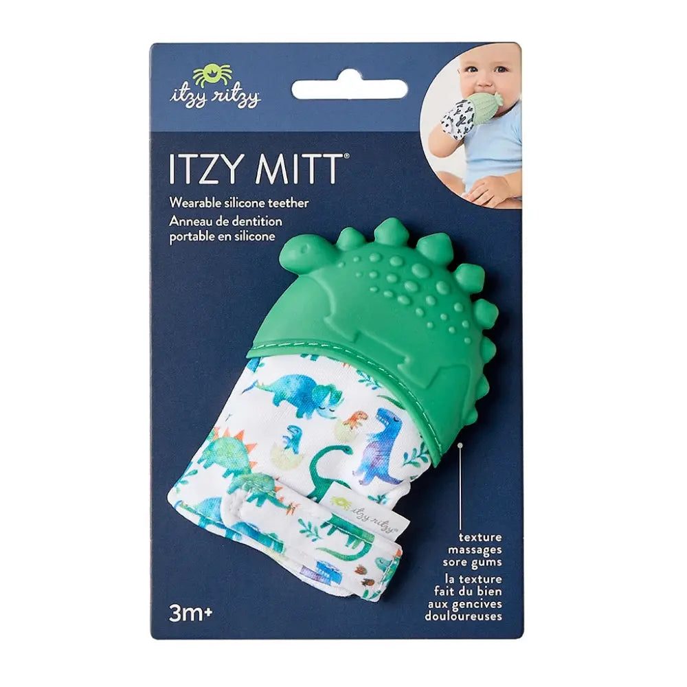 ITZY RITZY Itzy Silicone Teething Mitts, green dinosaur silicone with printed sleeve worn on a baby's hand