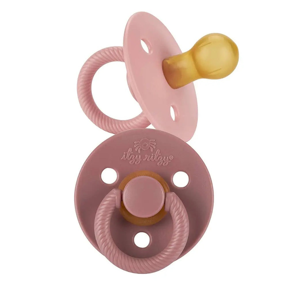 Itzy Ritzy Itzy Soother Natural Rubber Pacifier Set, pink shield with yellow nipple, 0–6M, textured ring handle.