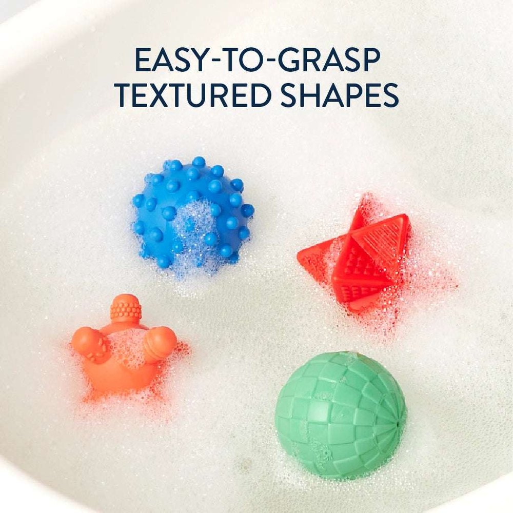 Itzy Splash Bath Toys Gift Set featuring blue textured ball, orange crab, red brick shapes, and green tiled ball