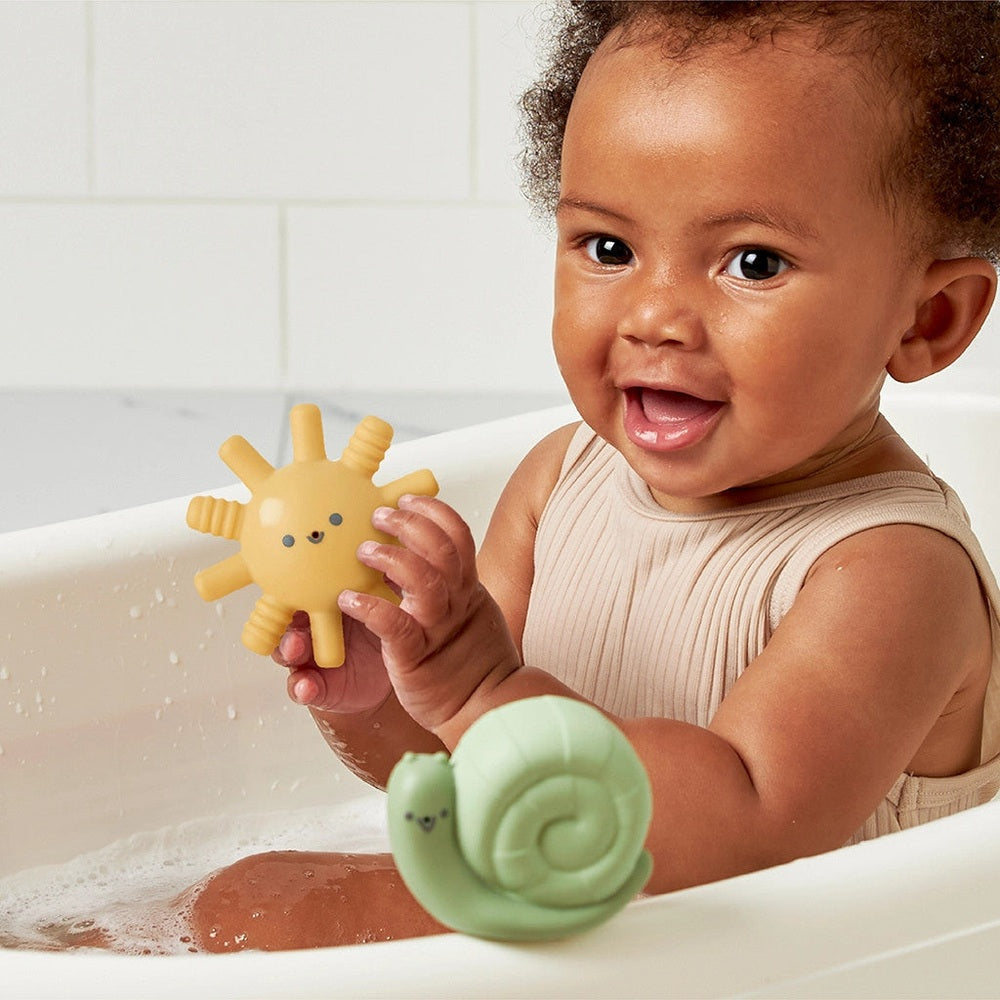 Itzy Ritzy bath toys: yellow sun and green snail, 2 toys in tub