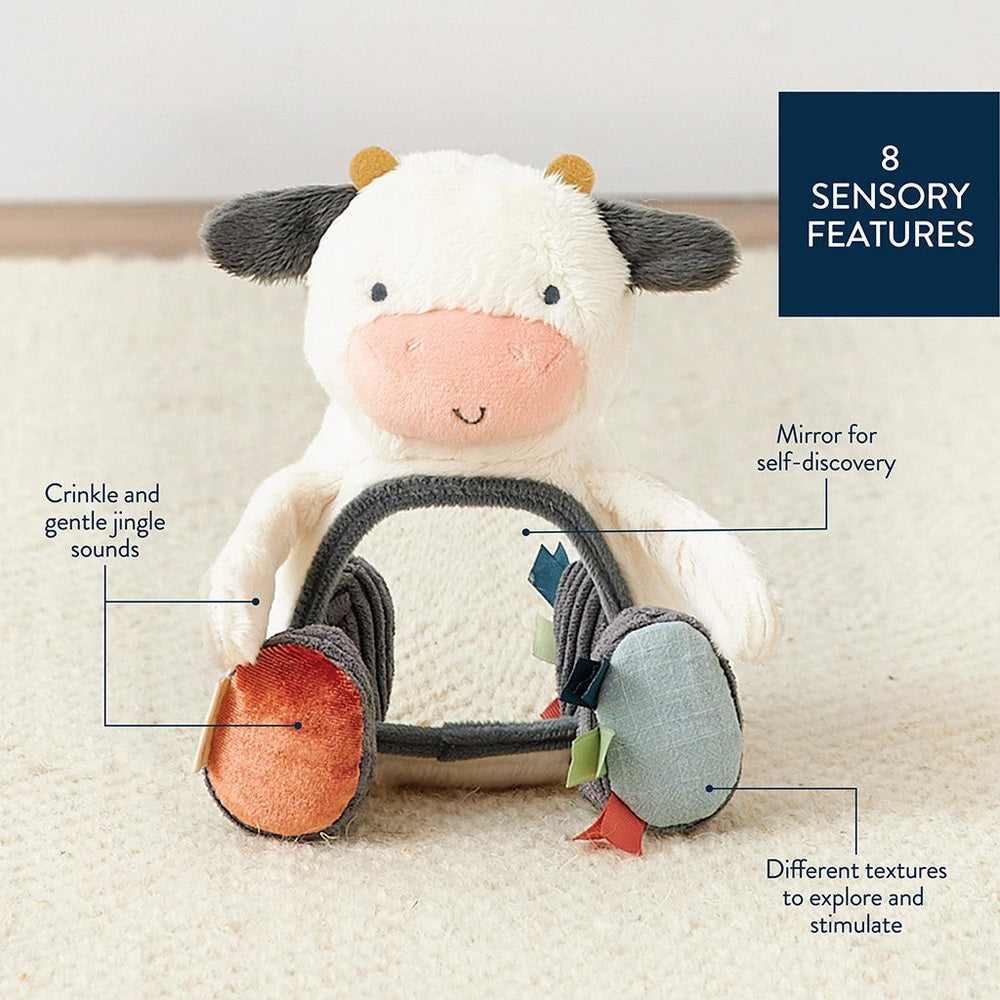 Itzy Ritzy Mirror plush toy cow for baby with soft textures and 8 sensory features