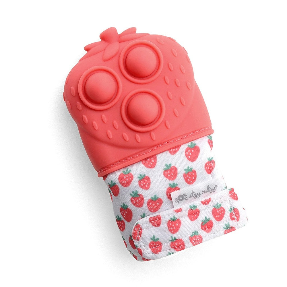 Itzy Ritzy Mitt Pop teething mitten in pink silicone with three circular nubs, strawberry-print fabric band.