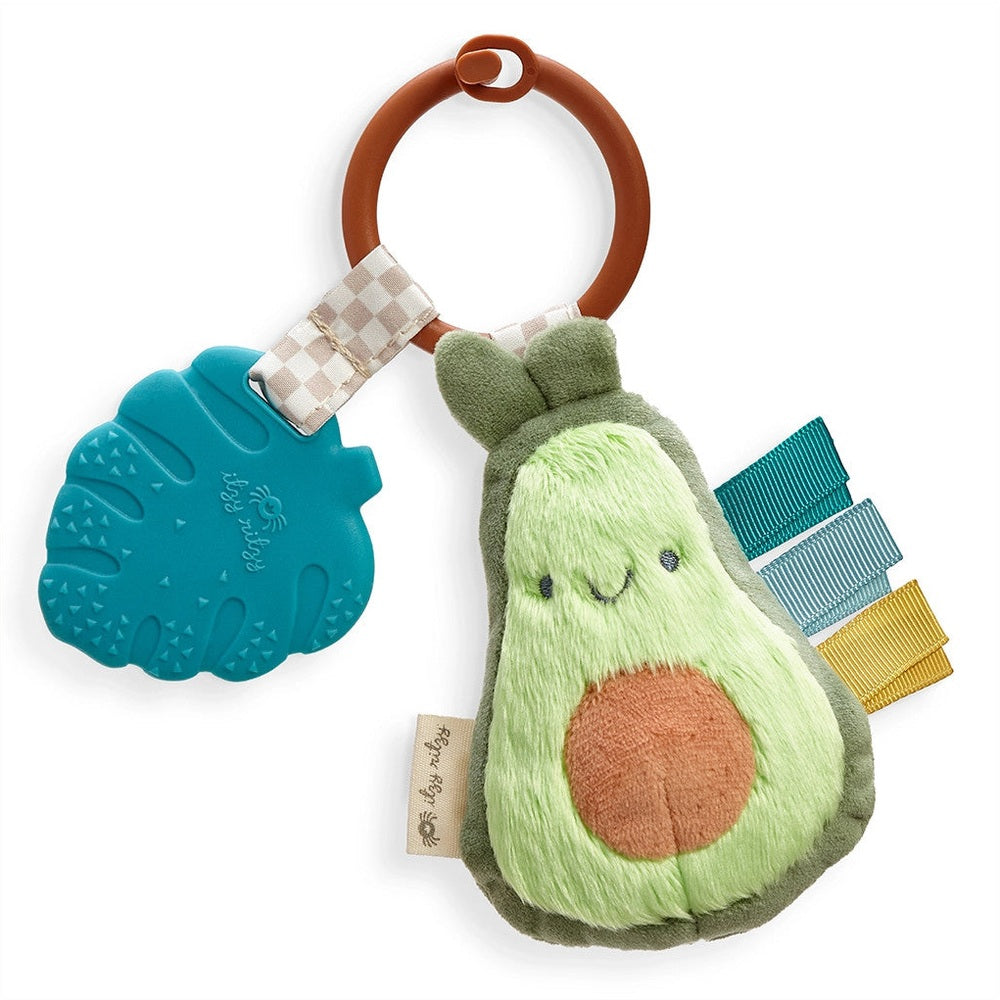Itzy Ritzy Pal plush avocado teether with teal silicone ring and multi-color ribbons