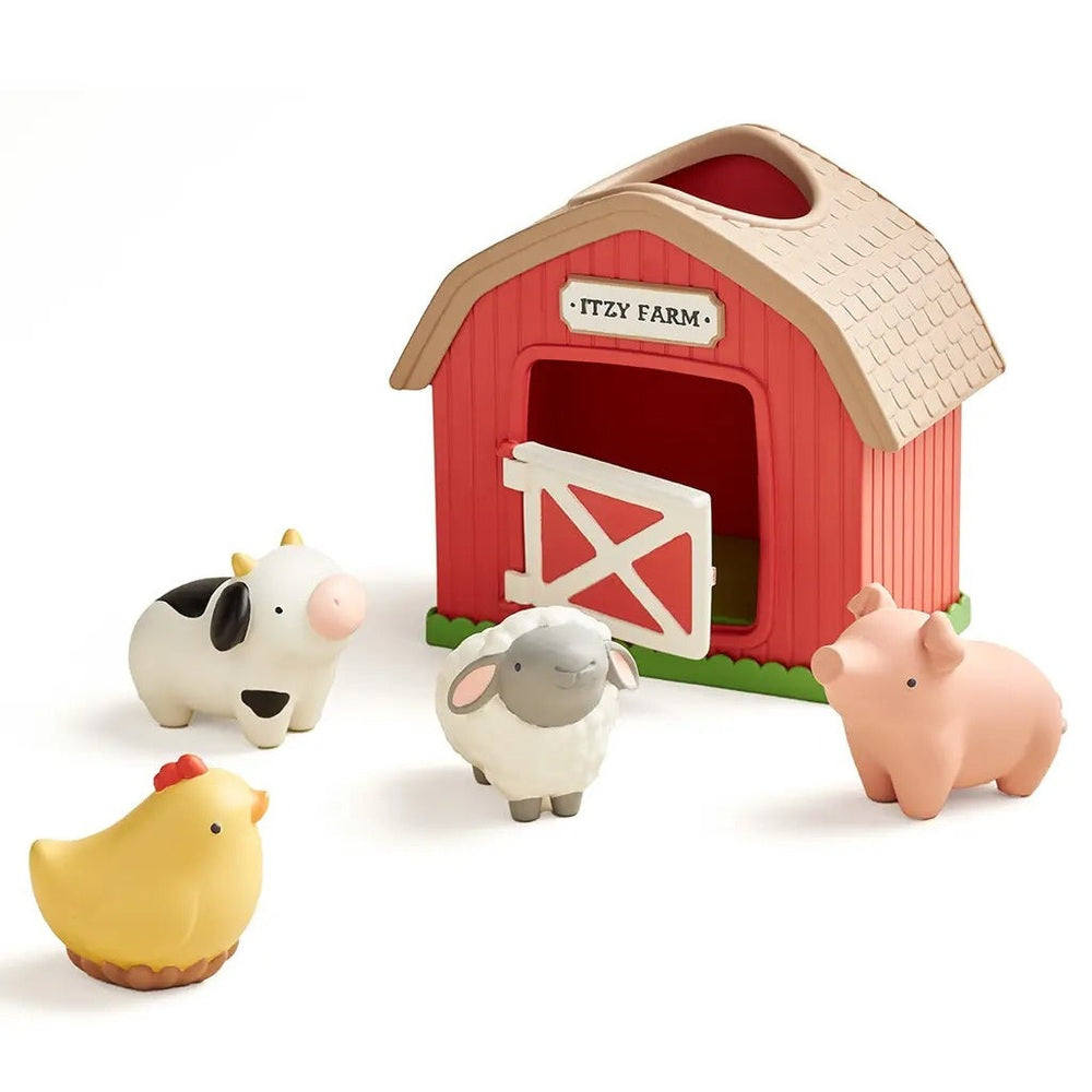 Itzy Ritzy Play Barn Spill and Fill Activity Toy: red barn with white gate and farm animals gathered nearby.