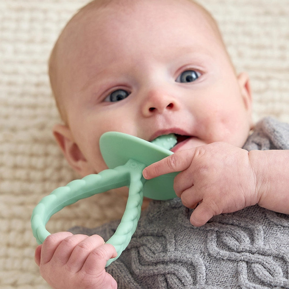 ITZY RITZY pre-feeding teether; mint-green silicone teether with braided handle