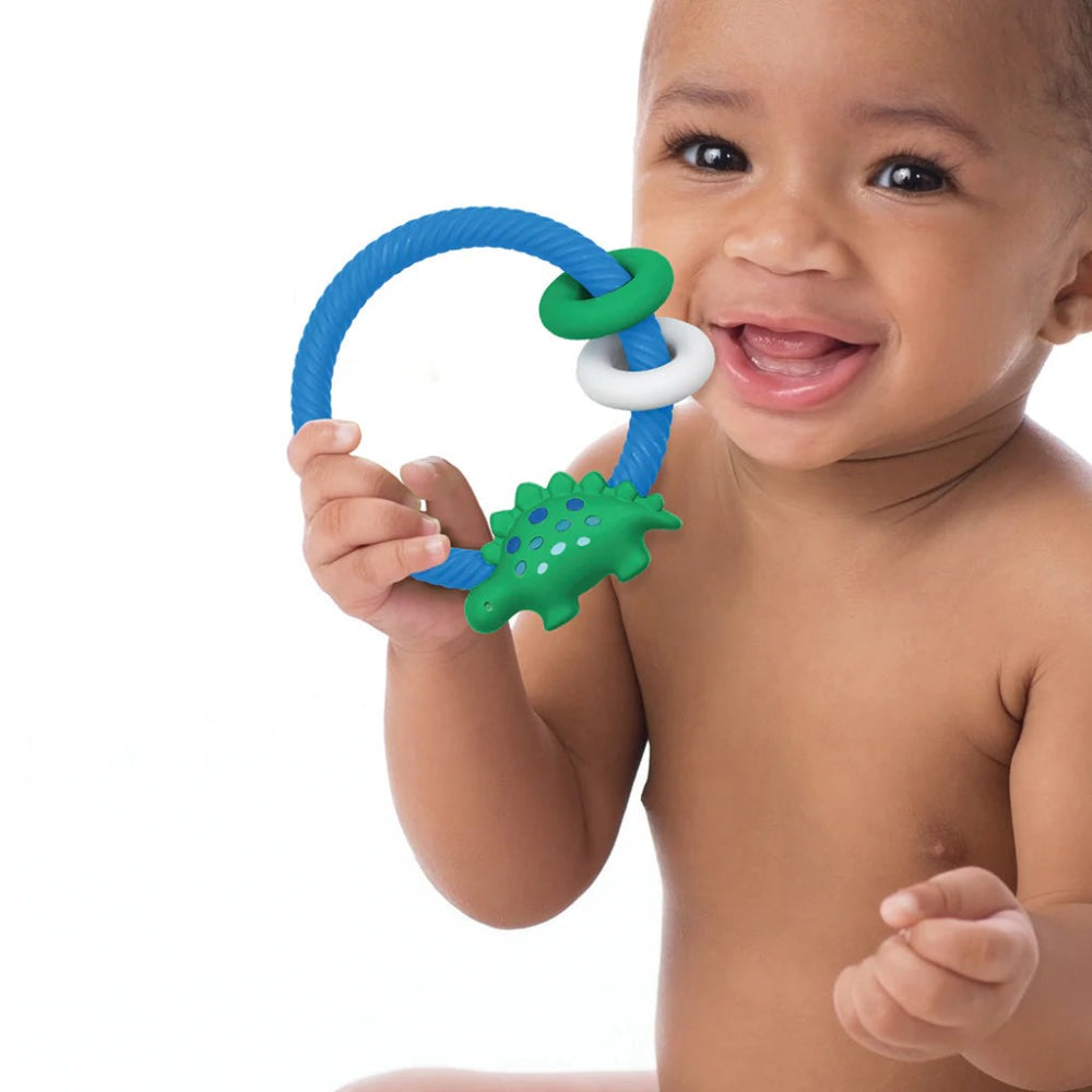 Itzy Ritzy silicone teething rattle for babies, blue hoop with green rings and a green dinosaur charm