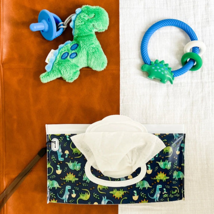 Itzy Ritzy rattle and silicone teether set (2 items) with a plush green dinosaur and blue ring teether