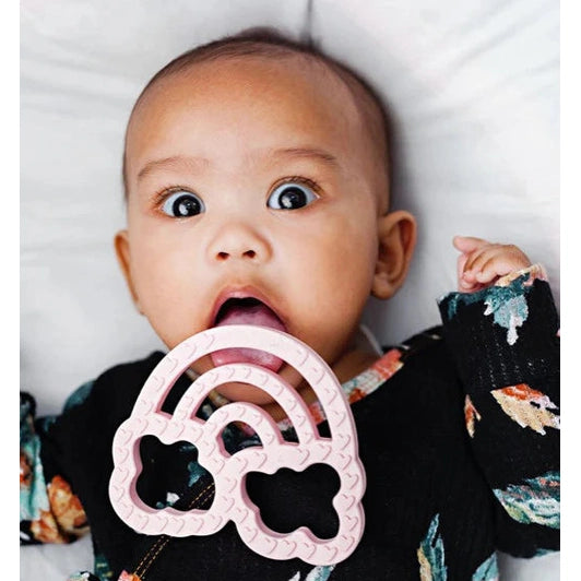 Itzy Ritzy silicone teether in pink featuring cloud arches for infants