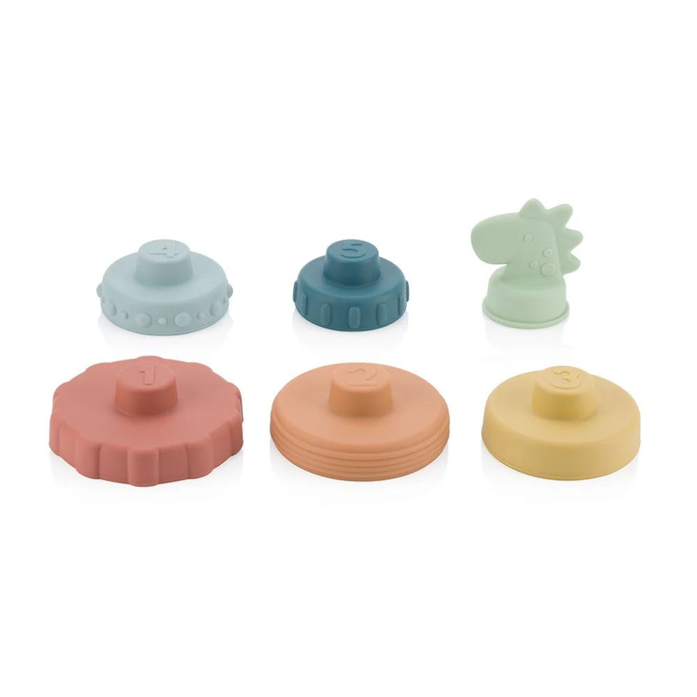 Itzy Ritzy silicone stacking toy set — 7 pieces: 6 pastel discs and a dinosaur figure