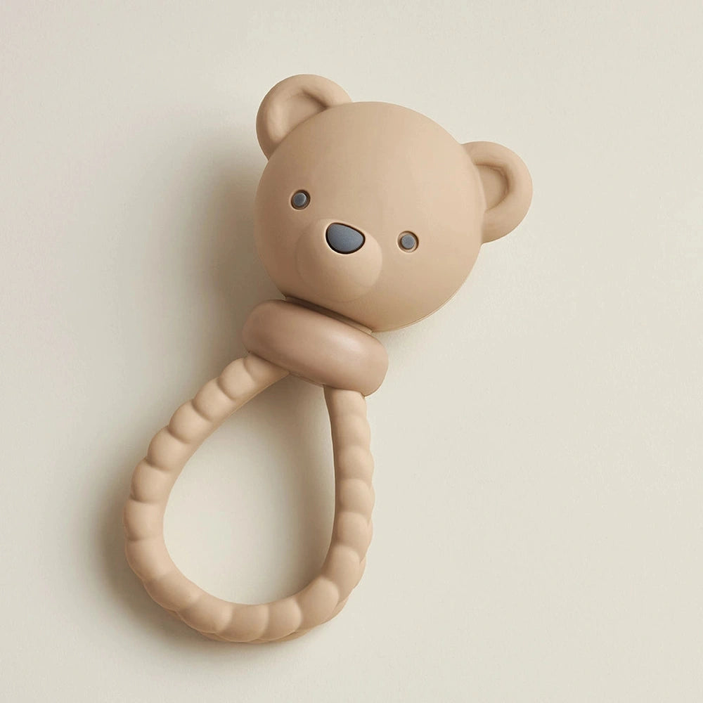 Itzy Ritzy Sweetie Rattle Bear teething toy with beige bear head and ribbed ring handle