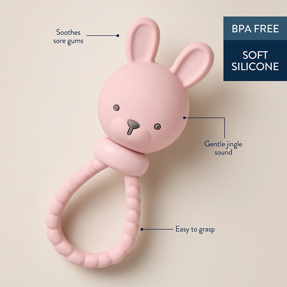 Itzy Ritzy Sweetie Rattle Pink Bunny, BPA-free soft silicone with easy-to-grasp loop and gentle jingle.