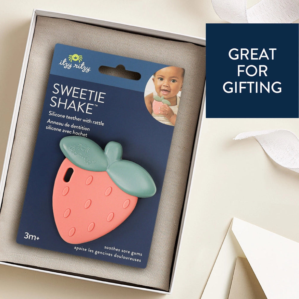 Itzy Ritzy Sweetie Shake strawberry teether; pink silicone with mint-green leaves, 3m+