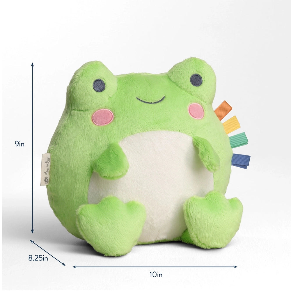 Itzy Ritzy Sweetie Snuggles Plush frog toy, lime green with white belly, featuring colorful sensory tabs for little hands.