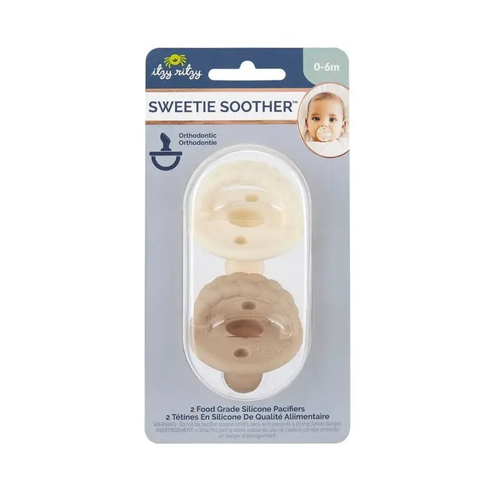 Itzy Ritzy Sweetie Soother Orthodontic Pacifier Sets (6-18M) showing two beige silicone pacifiers displayed in packaging.