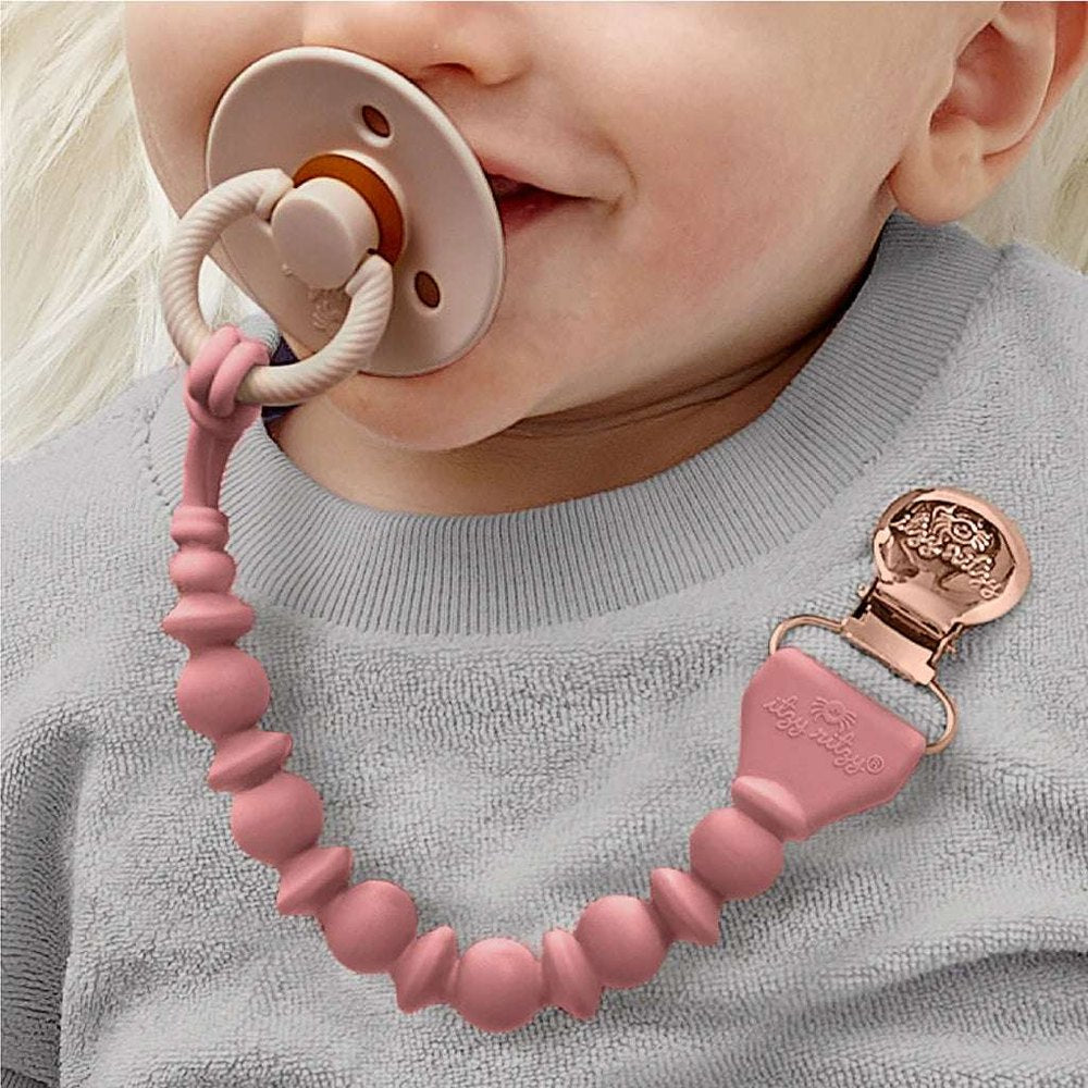 Itzy Ritzy Sweetie Strap Beaded Pacifier Clip with pink silicone beads and rose-gold clip