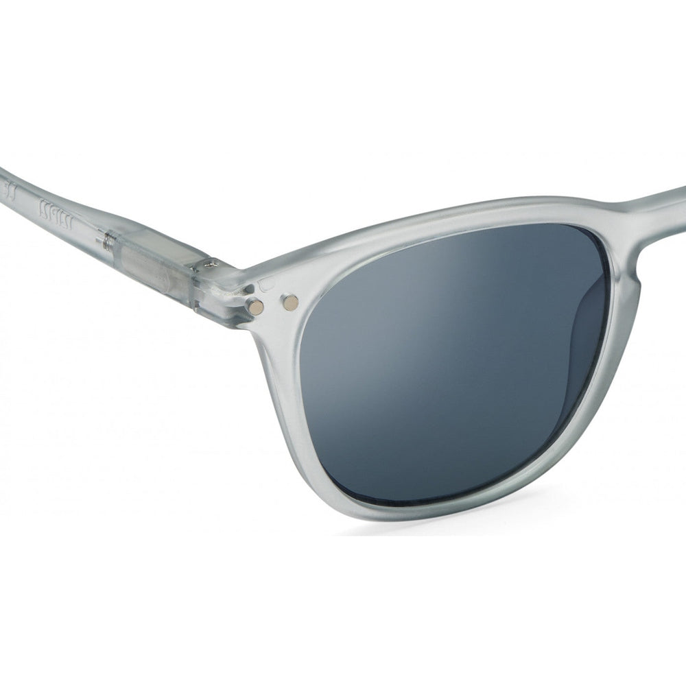 Izipizi Sun Junior #E Frosted Blue sunglasses with translucent frame and dark lenses