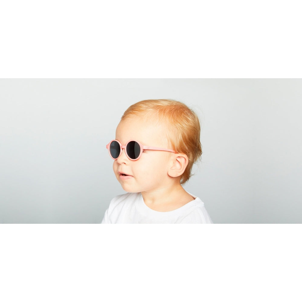 Kids pastel pink IZIPIZI sunglasses with round frames for toddlers