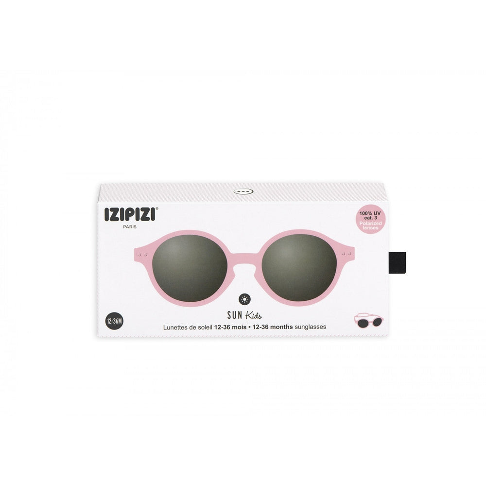 IZIPIZI Kids pastel pink sunglasses with round frames and dark lenses in white packaging sleeve