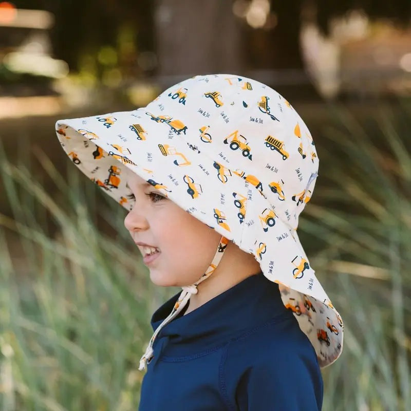 Jan & Jul Cotton Adventure Hat Little Diggers, white with yellow construction vehicles, wide brim and chin strap.