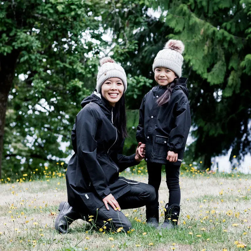 Jan & Jul Kids Cable Knit Twinning Beanies Grey worn by a mother and child outdoors in matching cozy knit hats.