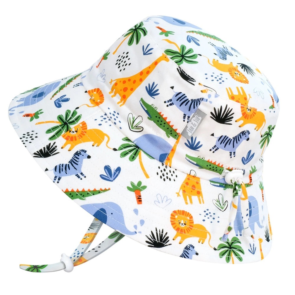 JAN & JUL Kids Cotton Safari Bucket Hat in white with colorful animal print, chin strap fastened.