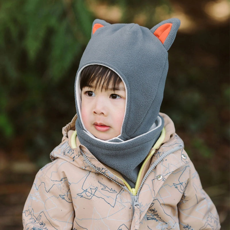 Jan & Jul Kids Fleece Animal Grey Fox hat with orange ears; toddler wearing the hooded fleece outdoors.
