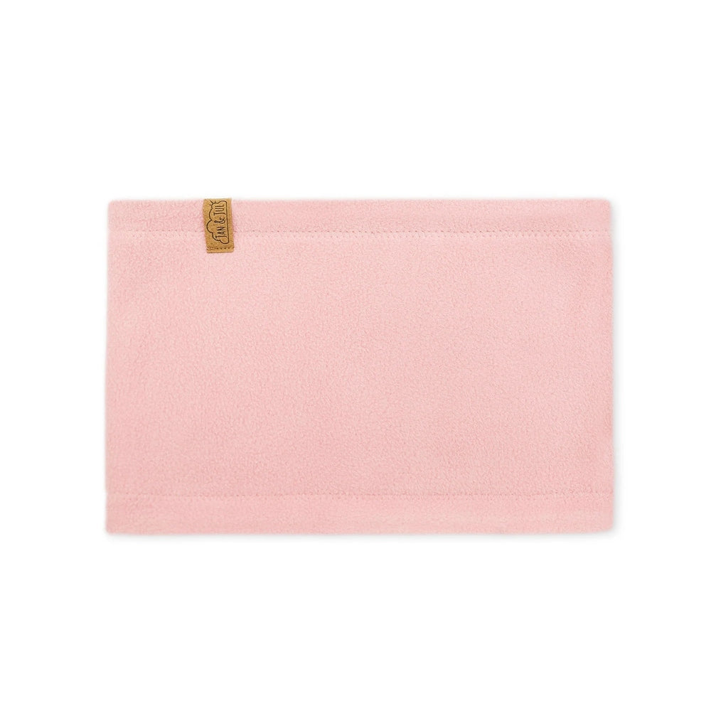 JAN & JUL Kids Fleece Neck Warmer in soft pink fleece, laid flat with tan logo tag